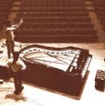 Todd adjusting the dual microphones over a Bogendorfer Imperial grand piano for optimum recording capability