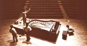 Todd adjusting the dual microphones over a Bogendorfer Imperial grand piano for optimum recording capability