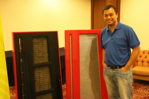 CEO of Clarisys Audio Pte Ltd Kurt Wee posing next to his Clarisys speakers.